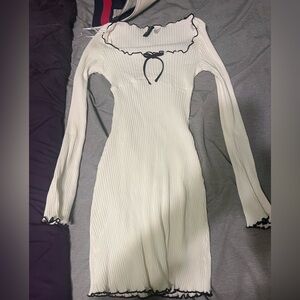 white long sleeve tight dress with a bow